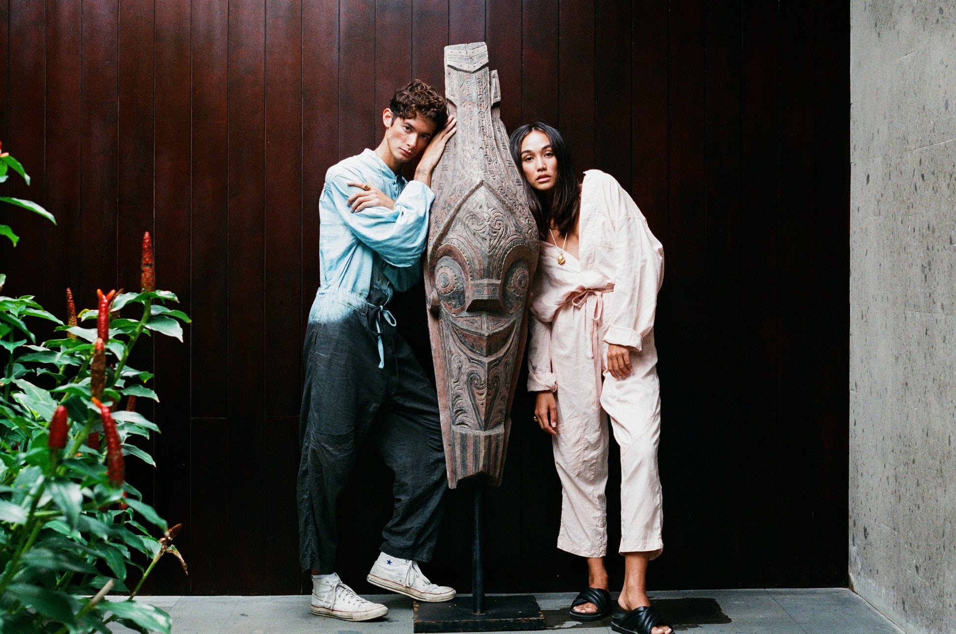 Look book photo Adventure Sail Jumpsuit in Two Tone Earth Meets Ocean and One Tone Coconut Pink featuring models Johnny and Amira.